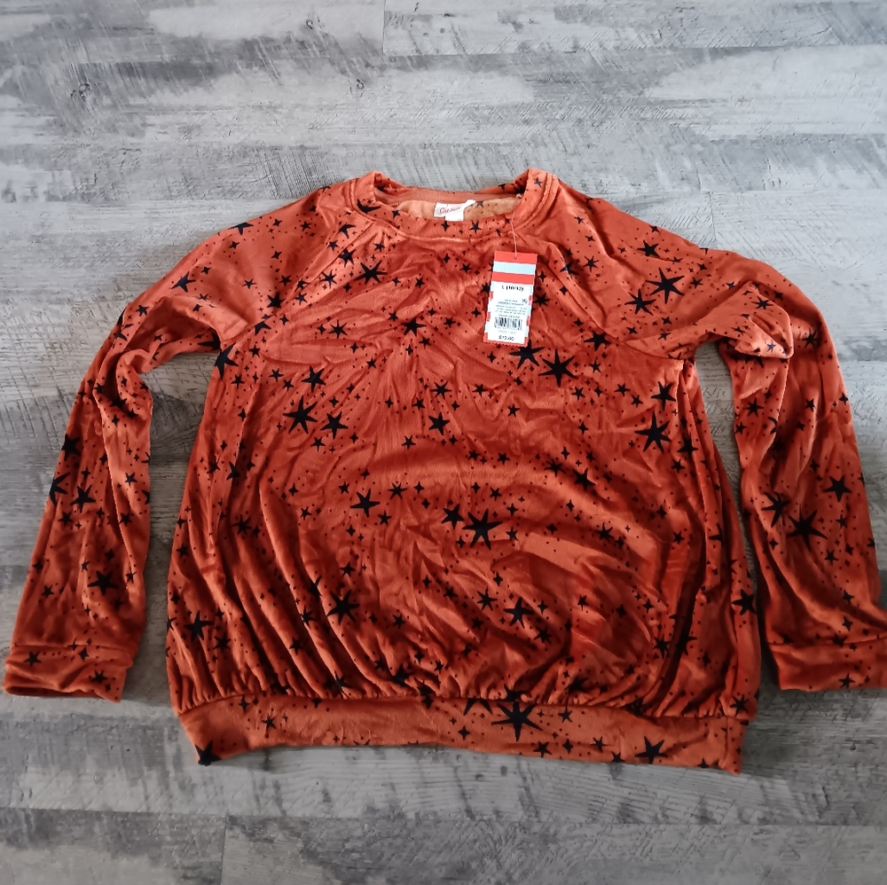 Orange with black stars cat &Jack shirt